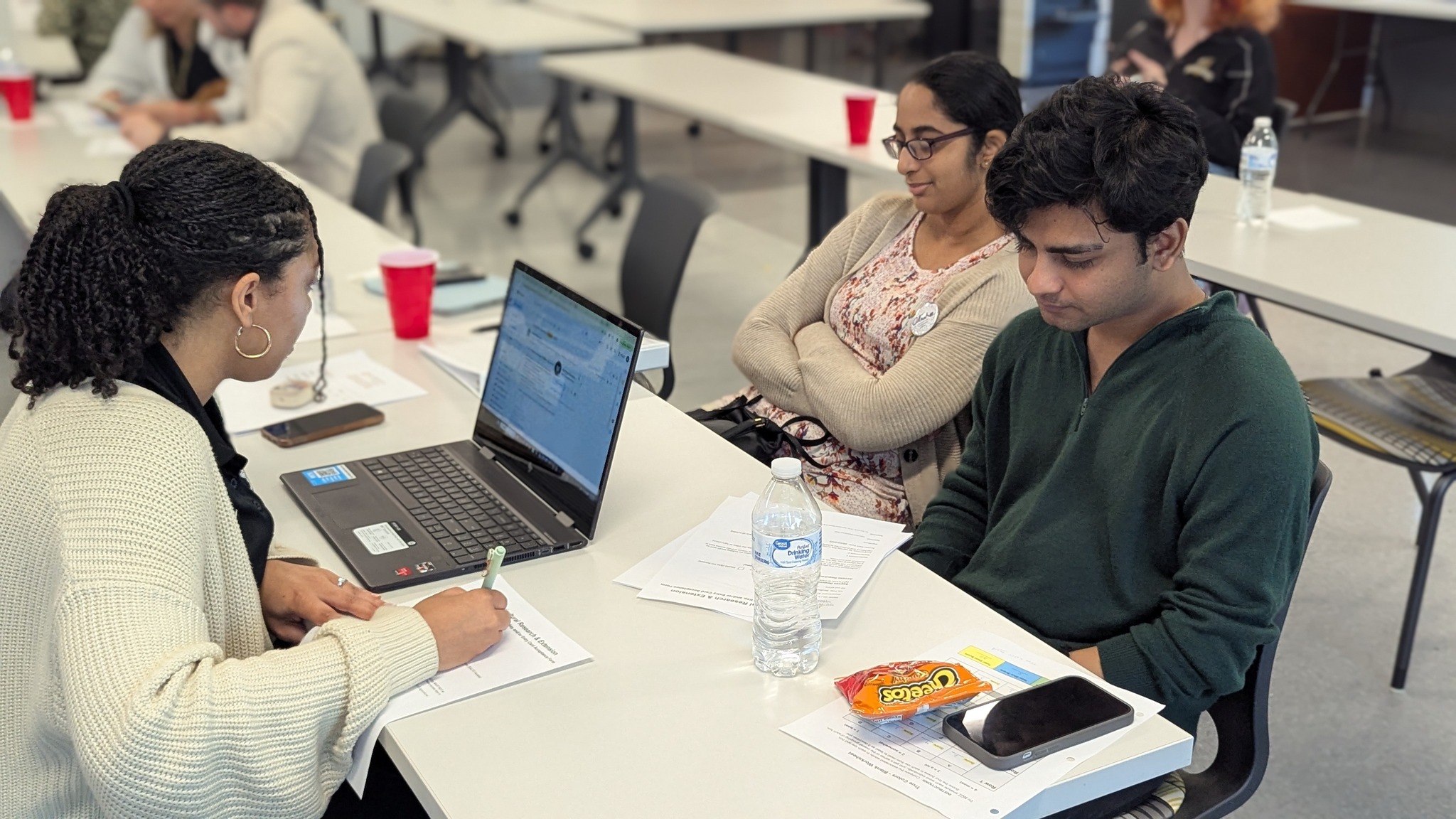 Undergraduate students working on laptops