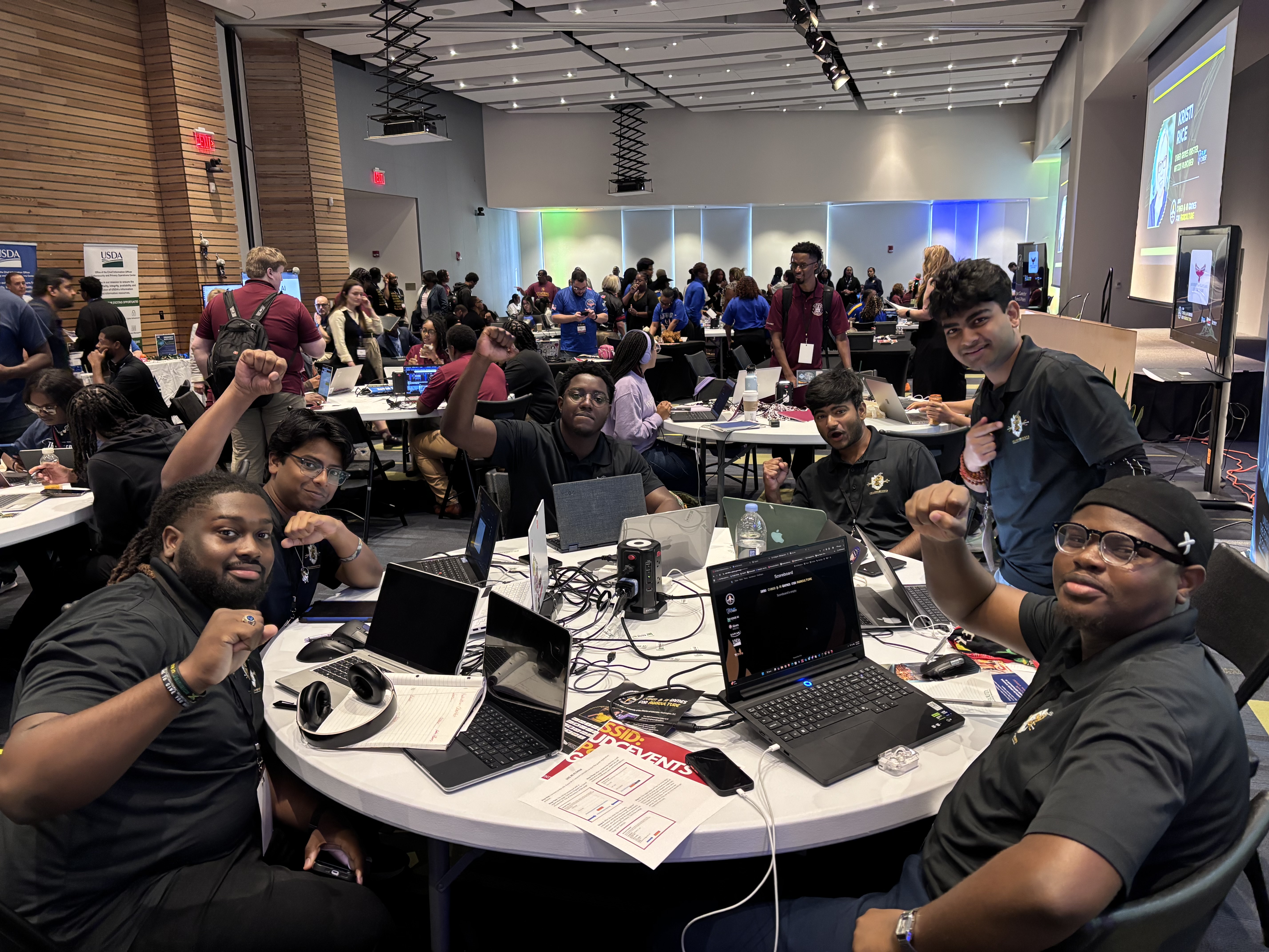 Graduate students collaborating on cybersecurity research